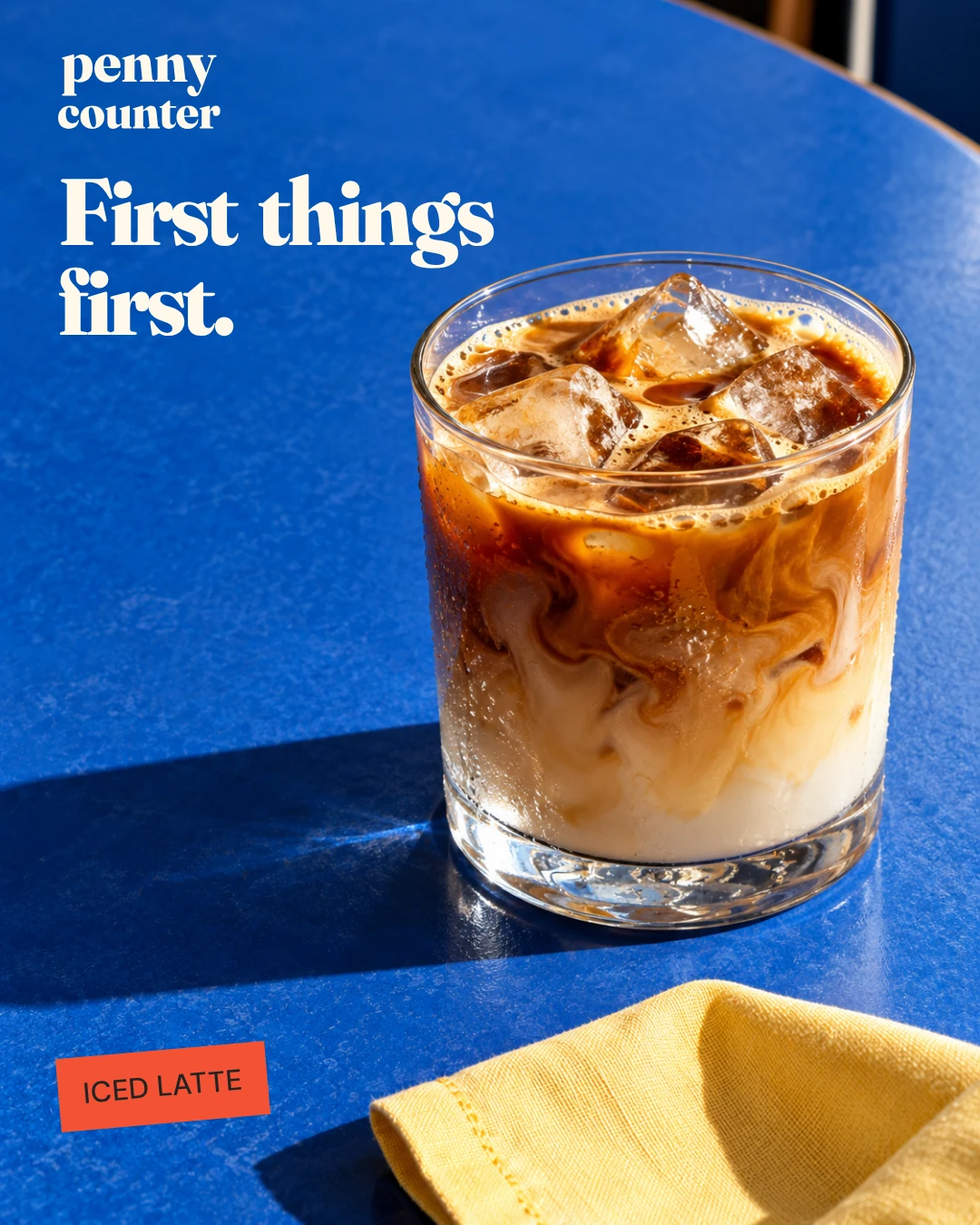 Penny Counter iced-latte post, with First things first lettering on blue.